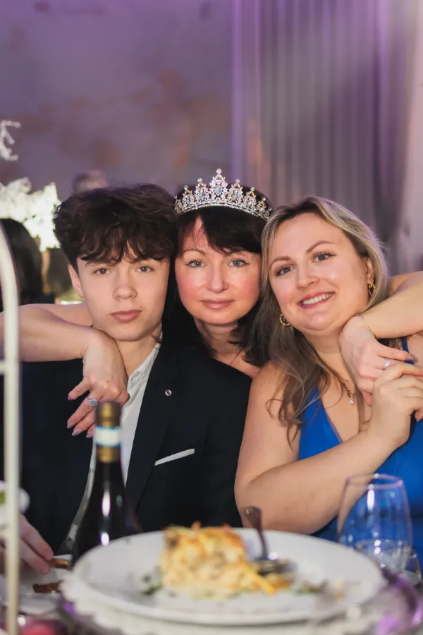 Birthday girl tiara teen son daughter at table