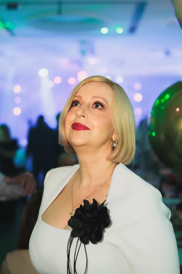 Blonde woman white blazer close portrait looking up