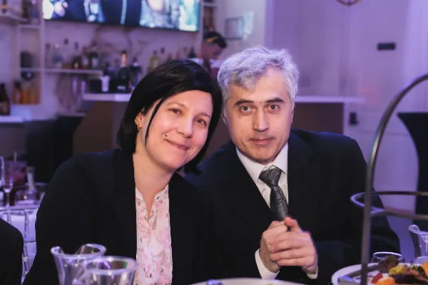 Couple dark haired woman grey haired man tie