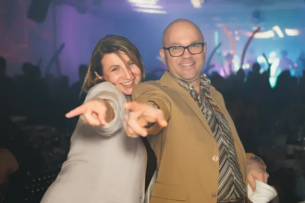 Couple pointing at camera dancefloor