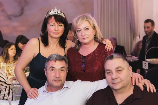 Four guests birthday girl tiara group pose