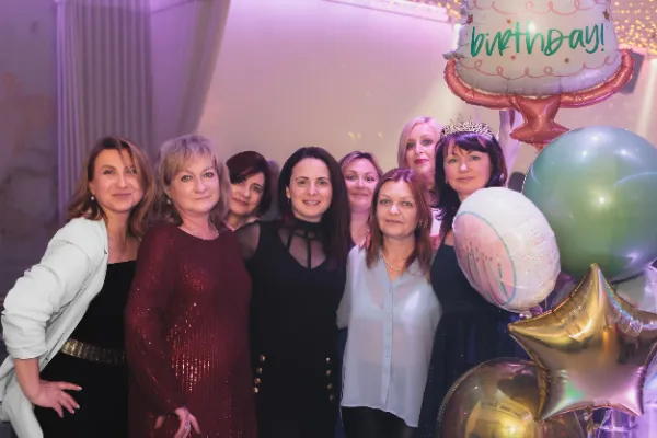Group eight women birthday balloons display