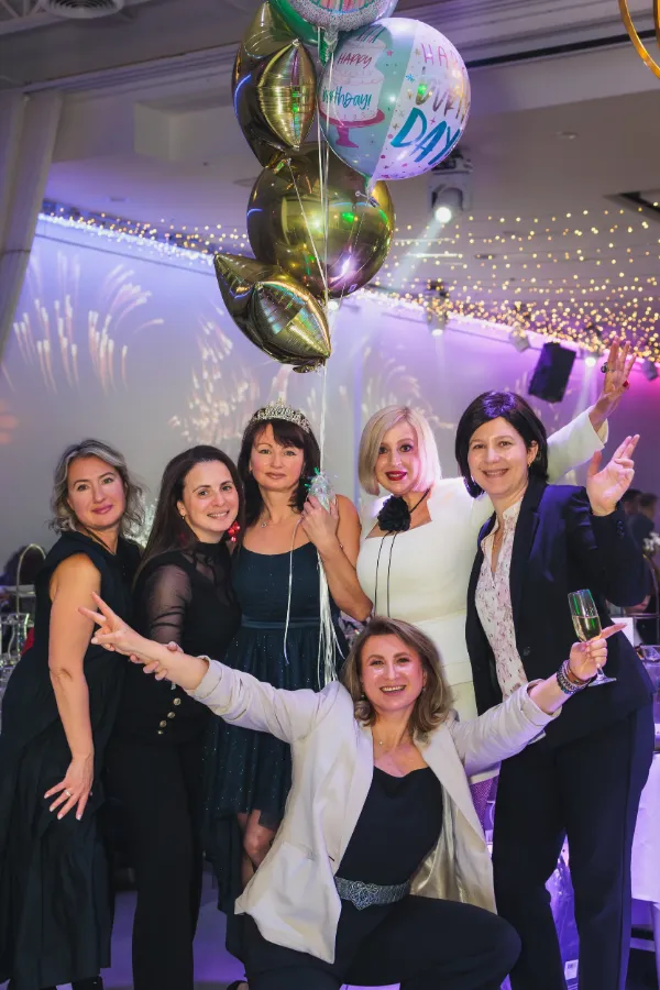 Six women group happy birthday balloons