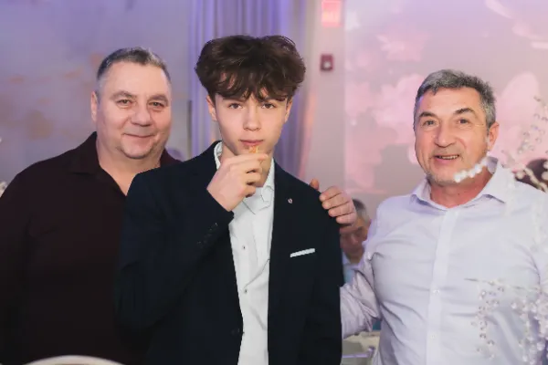 Teenage boy with two older men group