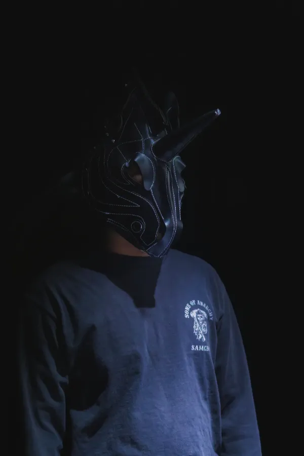 Bts actor wearing dark unicorn mask dark background