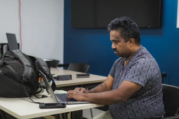 Bts crew member working laptop production room