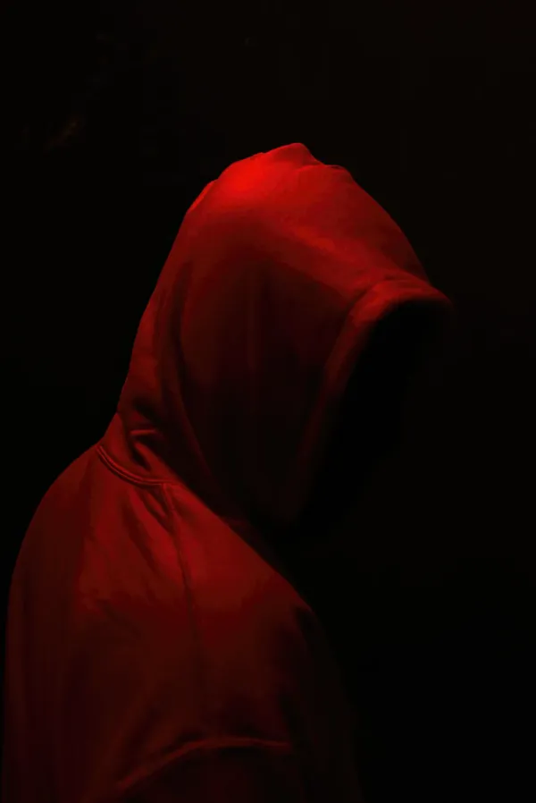 Red hood short film faceless figure side profile red hue black background 02