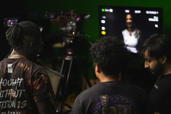 Bts mv three crew reviewing playback monitor green screen