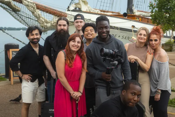Full cast crew group photo toronto waterfront tall ship bg