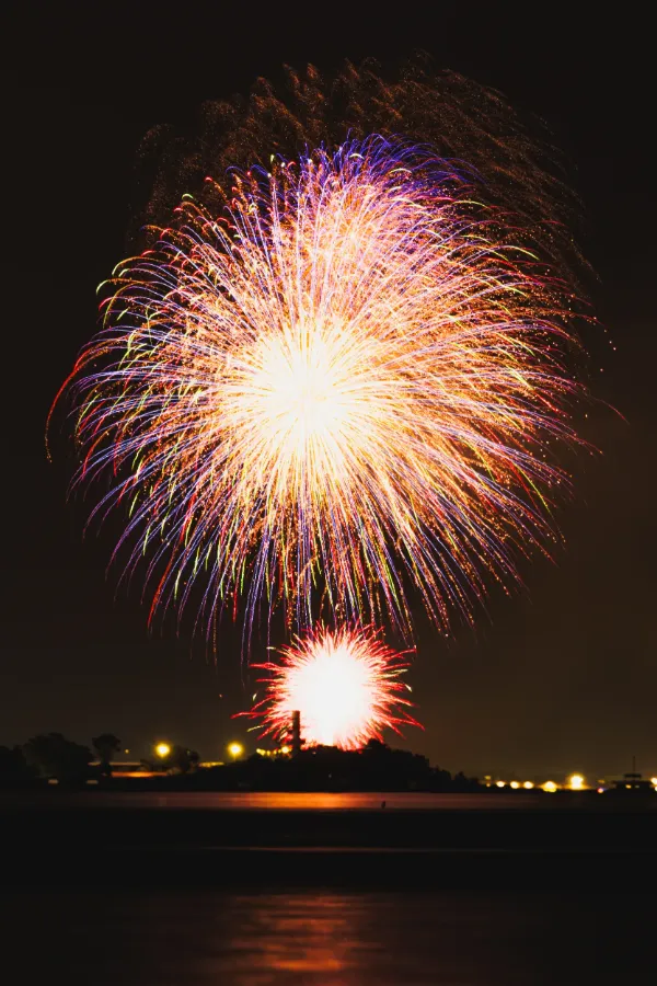 Toronto island canada day fireworks two bursts over lake night